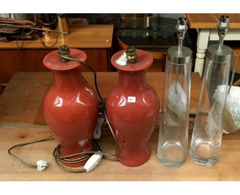 A pair of baluster form ceramic table lamps, 38cmH, together with a pair of tapering glass table lamps 