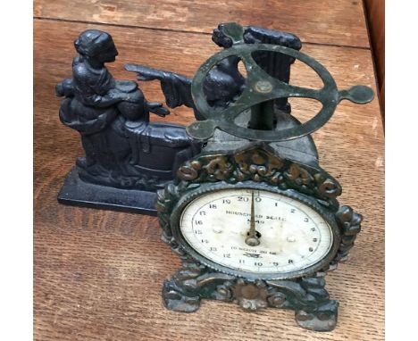 A cast iron door stop, together with a set of 19th century scales, 'No.49' 