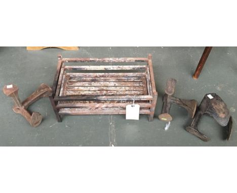 A cast iron fire grate, together with three cast iron shoe slobs 