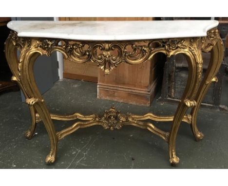 A Louis XVI style carved giltwood console table, the marble top above pierced scrolling foliate frieze, 138cmW 