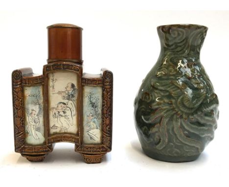 An unusual Chinese metal tea caddy (af), with canted corners and individual painted canvas scenes behind glass panels, marked