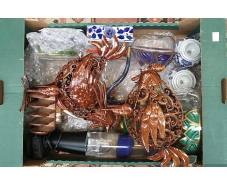 A mixed lot of items to include a lava lamp, glass teapots, and two metal cocks 