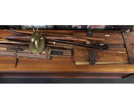 A mixed lot to include various walking sticks, brass horse's head, a 'J.A.N. Presser and Stretcher' press, bugle, and vintage