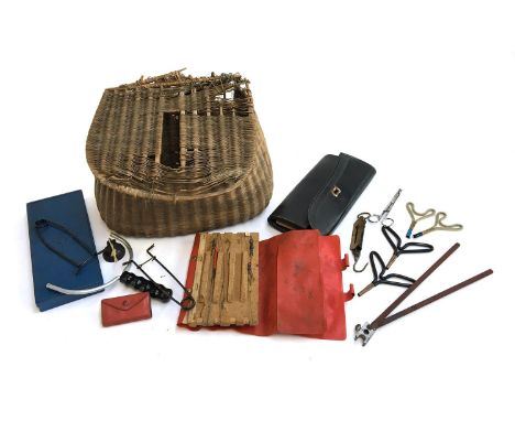 An early 20th century fishing creel, pocket balance, pike gags, rod rests, catapult; and two wallets of sea fishing traces, e