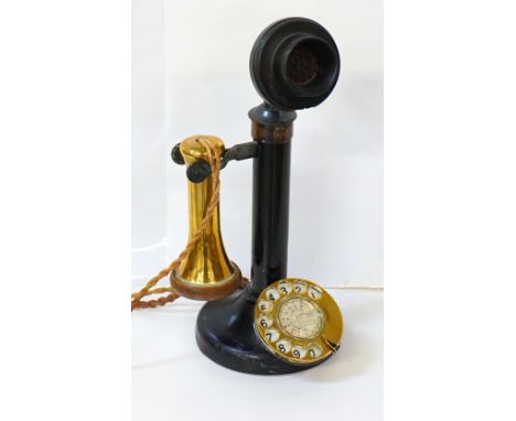 VINTAGE STICK TELEPHONEwith brass mounts, raised on circular base, 32cm high, with wire attached panel