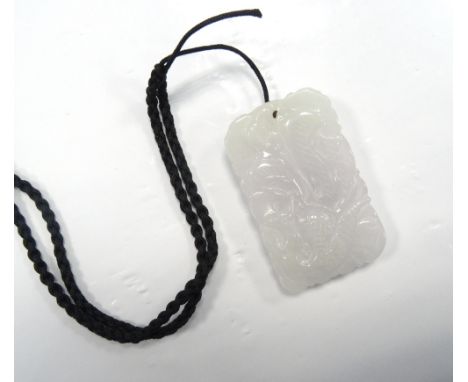 CARVED LIGHT PURPLE JADE PENDANTcarved with a dragon to one side and stylised bird to the other, approximately 4.9cm high