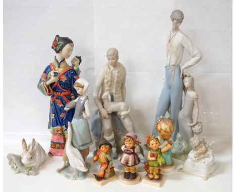 THREE LLADRO FIGURINESa young lady feeding a goose, 23.5cm high, a Putti seated in thought, 10.5cm high and a rabbit, 8cm hig