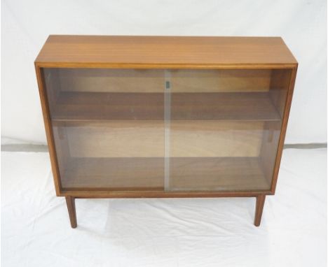 1960's BEAVER & TAPLEY 'MULTI-WIDTH FITTING FURNITURE' TEAK DISPLAY CABINETwith a pair of glass sliding doors revealing adjus
