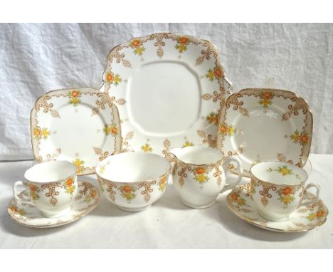ROYAL ALBERT CROWN CHINA TEA SERVICEwith floral and motif decoration on white ground, comprising twelve cups; twelve saucers;