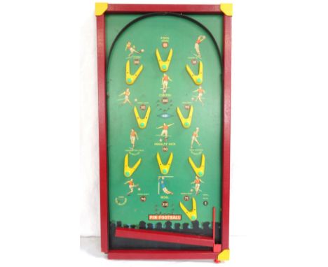 VINTAGE TABLE PIN FOOTBALL GAMEwith a green hardboard 'pitch' decorated with players and hoops for scoring, 75.5cm x 39cm 