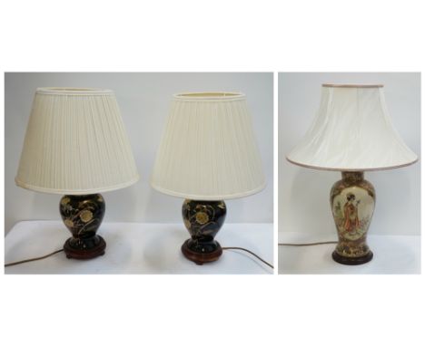 PAIR OF CHINESE GINGER JAR LAMPSthe black ground decorated with flowers and butterflies, each with a pleated cream shade, 51c