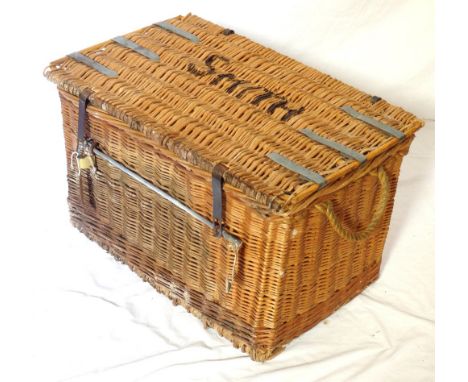 VINTAGE WICKER LAUNDRY BASKETwith a lift up lid stencilled Smith, with metal clasps and bar, and rope side carrying handles, 