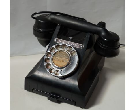 VINTAGE BLACK BAKELITE DIAL TELEPHONEwith a pull out index panel, the base marked 'G.P.O. Batch Sampled', with a Glasgow exch