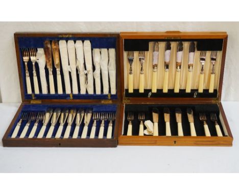 VINTAGE OAK CASED CUTLERY CASEcontaining a twelve place fish service; together with a teak cutlery case containing an eight p