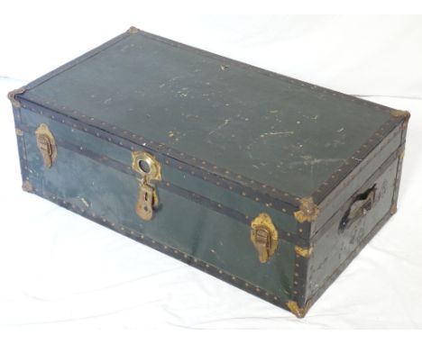VINTAGE TRAVEL TRUNKwith reinforced corners, side carrying handles and a vintage label   