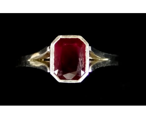 A Platinum Solitaire Ruby Ring, Modern, set with a natural emerald cut ruby, approximately 1.40ct, with certificate, size K, 