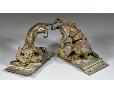 An Unusual Pair of Gilt Bronze Hinged Lions, 19th Century, one attacking a snake, the other atacking a deer, the male 8ins wi