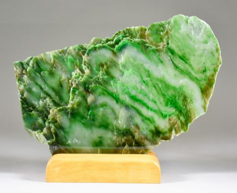 A Polished Slice of Green Nephrite Jade From North British Columbia, 12.75ins x 8ins, on wooden stand Provenance: Gregory Bot