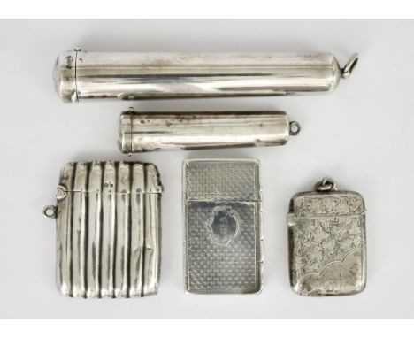 A Victorian Silver Rectangular  Vesta Box and Four Other Cases, the box by Edward Smith, Birmingham 1851, with shaped thumbpi