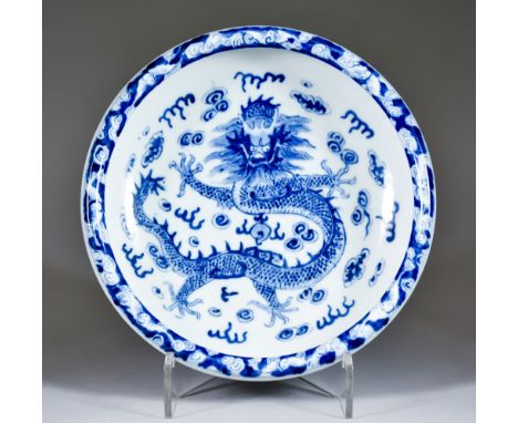A Chinese Blue and White Circular Bowl, Late 19th Century, painted with a dragon amidst cloud design, 10ins (25.5cm) diameter