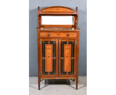 A Late Victorian Walnut, Ebonised and Satinwood Dwarf Cabinet of Aesthetic Design, with open shelf on slender turned supports