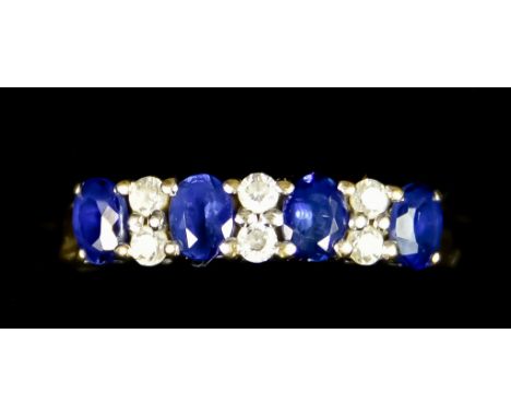 A 9ct Gold Sapphire and Diamond Ring, Modern, set with four sapphires, approximately .60ct total, inter spaced with small whi