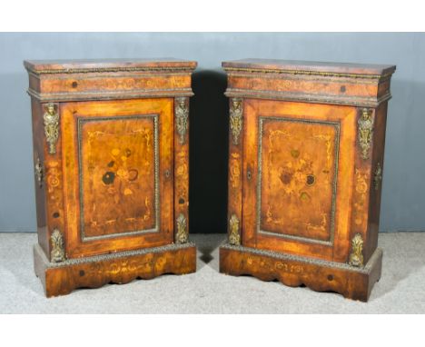 A Pair of Victorian Figured Walnut and Gilt Metal Mounted Pier Cabinets, the front inlaid with leaf scroll and floral ornamen