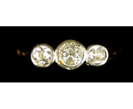 An 18ct Gold Three Stone Diamond Ring, 20th Century, set with three old European cut diamonds, approximately .60ct total, siz