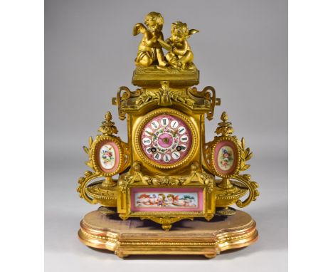 A 19th Century Gilt Metal and Porcelain Mounted Mantel Clock, by Japy Freres  No. 1442, the 3ins diameter enamel dial with Ro