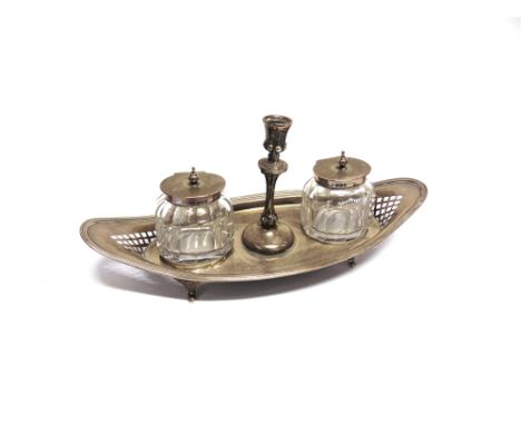 A SILVER STANDISH by H. Atkin, Sheffield 1906, the boat shaped stand with pierced ends, on four bracket supports, with a tape