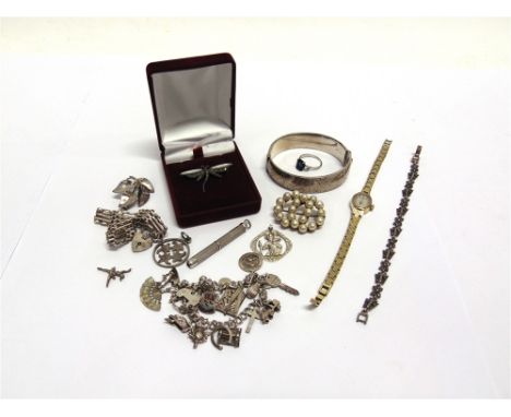 A SILVER HINGED BANGLE  a bracelet with charms attached; and other silver and metal jewellery; also a lady's Rotary bracelet 