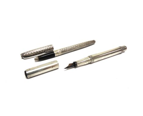 AN ENGINE TURNED DECORATED BALLPOINT PEN  stamped EBOS to the clip, and engraved around the cup rim 'Tiffany Germany Sterling