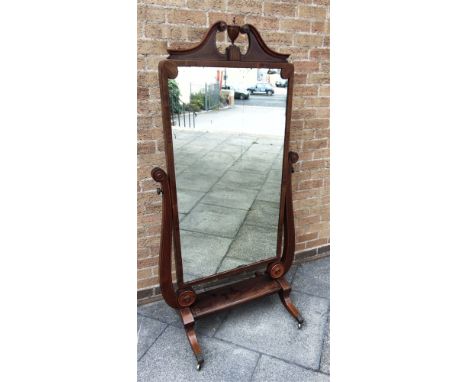 A MAHOGANY CHEVAL MIRROR WITH INLAID DECORATION  swan neck pediment with vase finial, the glass 64cm x 115cm high, 87cm wide 