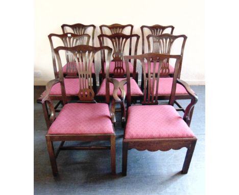 SEVEN MATCHING MAHOGANY DINING CHAIRS  with pierced splats and drop-in seats, together with a similar commode armchair
