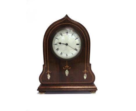 AN EDWARDIAN MAHOGANY MANTLE CLOCK  with marquery and mother of pearl inlaid decoration, 19cm wide 24cm high