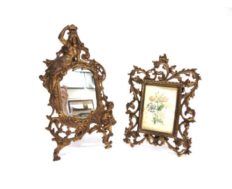 AN ART NOUVEAU STYLE GILT METAL FRAMED MIRROR  with figural mount, stamped 'BEATRICE' 36cm high 20cm wide, and another simila