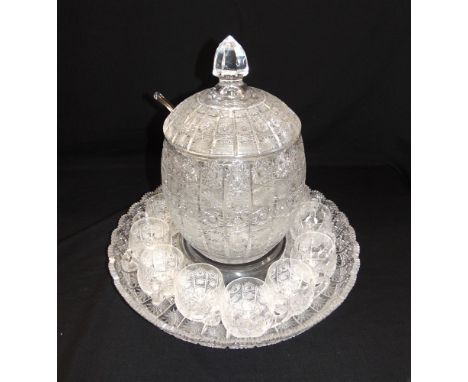 A LARGE CUT GLASS PUNCH SET  comprising lidded bowl on stand, ladle and twelve cups, the stand 43cm diameter