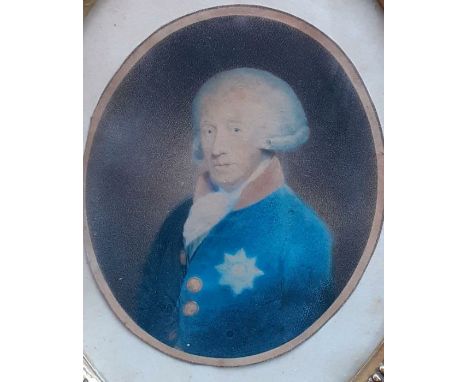 A royal (George II?) with the Garter star medal, a hand-coloured print within a gilded oval and pearled frame, (28.5x22.5 cm)