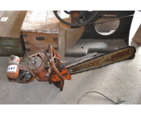 A vintage Tornado petrol driven chain saw