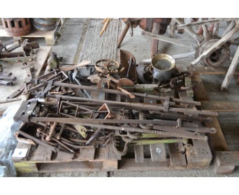 A quantity of old mostly iron cart furniture and accessories; a jack; part of a seed drill; part carriage lamp etc. 