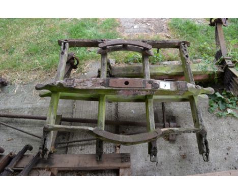 A vintage cart axle, turntable, draw bar etc.
