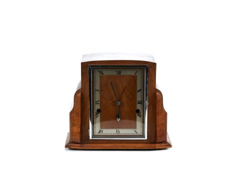 AN ART DECO INFLUENCE WALNUT VENEERED MANTLE CLOCK, rectangular dial with three train Winegartens movement, 10 ins high.   