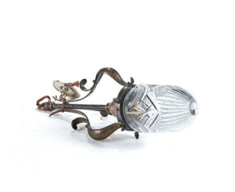 AN EDWARDIAN ART NOUVEAU SILVER-PLATED HANGING LIGHT FITTING with spot hammered scrolling arms and cut-glass beehive shade, 1