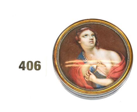 A 19TH CENTURY CIRCULAR TORTOISESHELL SNUFF BOX, the glazed lid with painted panel of a lady with an asp, brass bezel, 3 1/4 