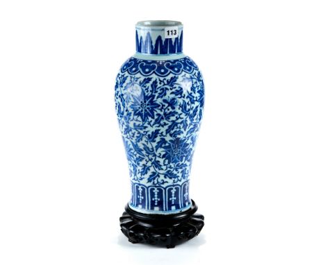 A 19TH CENTURY CHINESE BLUE AND WHITE PORCELAIN BALUSTER VASE decorated in under glaze blue with meandering foliage and lappe