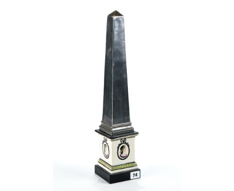 AN EARLY 19TH CENTURY WOOD &amp; CALDWELL TYPE POTTERY OBELISK, the grey/silvered column with cream glazed oval portrait pane