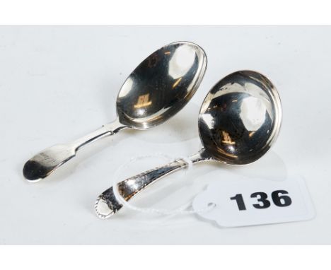 A GEORGE III SILVER FIDDLE-PATTERN CADDY SPOON, maker:- J.W, London 1818 and a period white metal CADDY SPOON, makers mark on