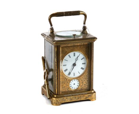 A LATE 19TH CENTURY FRENCH 8 DAY FOLIATE ENGRAVED BRASS CARRIAGE CLOCK, striking movement with alarm and repeat, 5 ins high. 