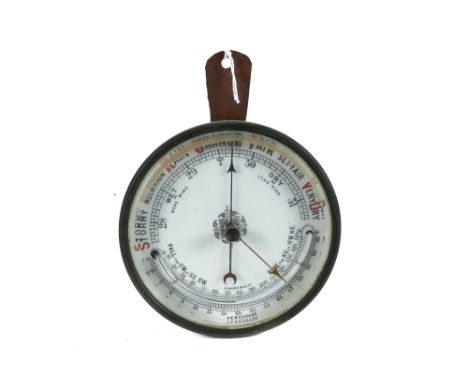 A LATE 19TH CENTURY CIRCULAR BRASS ANEROID BAROMETER, white porcelain dial with internal thermometer, 5 ins diameter.    