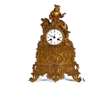 RAINGO FRERES, PARIS, A 19TH CENTURY FRENCH ORMOLU MANTLE CLOCK, circular enamel dial and twin train movement, the foliate ca
